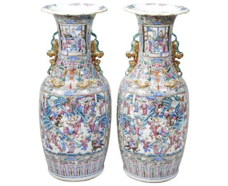 A MONUMENTAL PAIR OF FAMILLE ROSE CANTON VASES QING DYNASTY, 19TH CENTURY of baluster form, the sides painted with panels of 