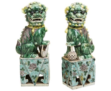 PAIR OF FAMILLE VERTE LIONS&nbsp; KANGXI PERIOD (1662-1722) modelled as seated male and female lions,&nbsp;the male with his 