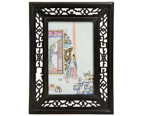 A FAMILLE ROSE PLAQUE REPUBLIC PERIOD (1912-1949) painted with figures in an interior scene, hardwood frame 19.5cm x 12cm 