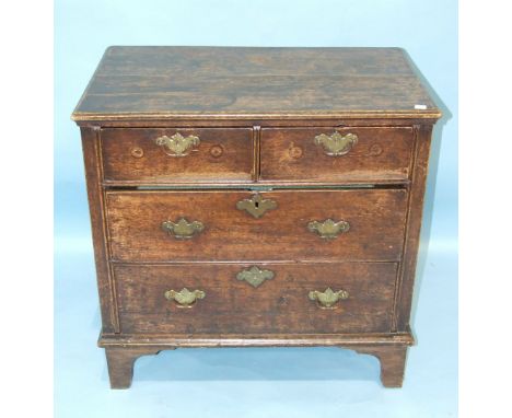 A reconstructed antique oak chest of rectangular form, having two short and two long drawers, on bracket feet, 79cm wide, 78c