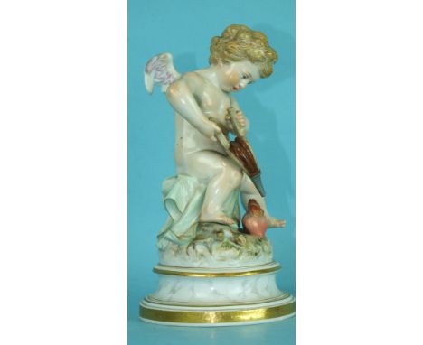 A 19th century Meissen porcelain figure of a winged cherub lighting the flaming heart with his bellows, incised L108 and cros