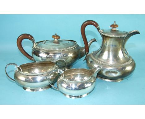 A four-piece silver tea service of plain oval compressed form, comprising teapot, sugar bowl, cream jug, Birmingham 1927, hot