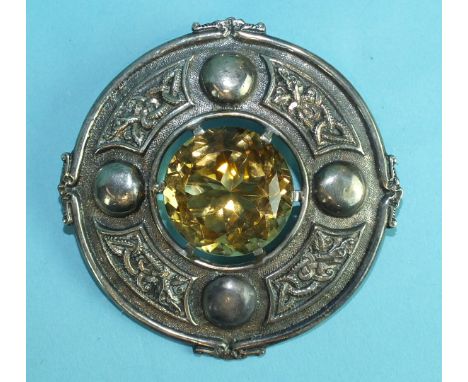 A large silver Celtic plaid brooch claw-set a citrine within border of knot-work panels and bosses, Edinburgh 1936, 7.9cm, 77