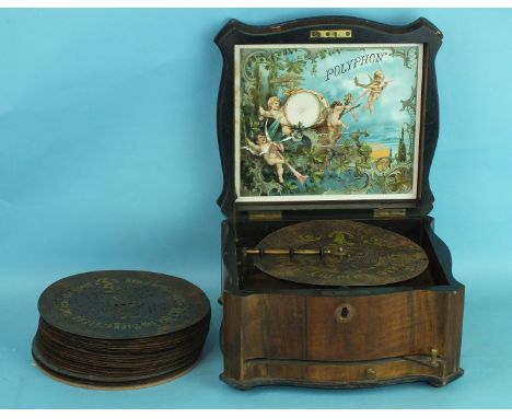A Victorian walnut Polyphon music box playing 8¼" discs, single comb in good order, 38cm wide, together with a collection of 