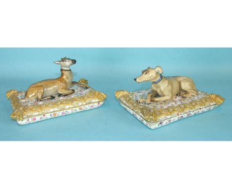 An unusual pair of 19th century Meissen porcelain perfume bottles modelled as a deer and a hound with removable heads, reclin
