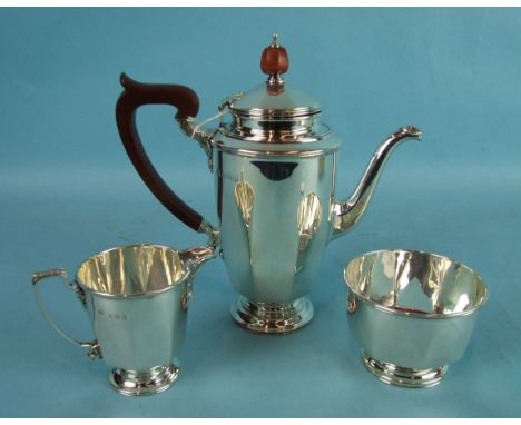 An early-20th century bachelor's three-piece coffee service of octagonal form, consisting of coffee pot with Bakelite handle 