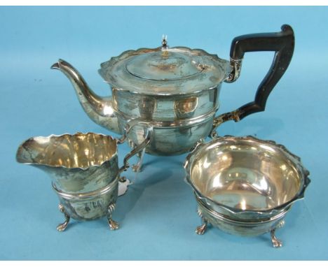 A three-piece silver tea service of plain form with serrated borders, Sheffield 1918 and 1920, maker HW, total weight ___19oz