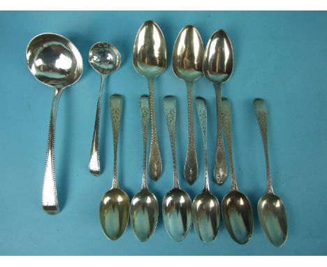 A George III beaded sauce ladle, London 1776, a Georgian feather-edged small sifter spoon, marks rubbed and nine Georgian bri