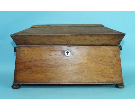 An early-19th century rosewood sarcophagus-shaped three-division tea caddy on bun feet, with mother-of-pearl lock plate and e