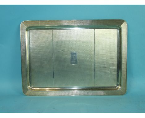 A 20th century rectangular engine-turned tray, 27 x 19.5cm, Birmingham 1949, maker WGS Ltd, ___15½oz.