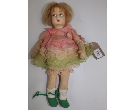 A Lenci fabric doll, pressed felt head with painted features on a felt and cloth body, arms, legs and head articulated, origi