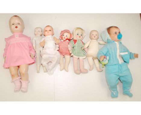 Seven miscellaneous dolls in plastic composition and porcelain, this lot includes a ceramic and fabric doll with painted hair