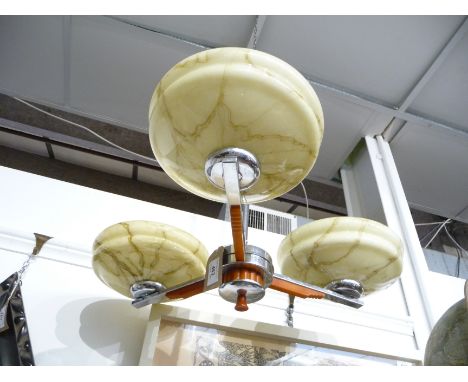 An Art Deco chrome three branch ceiling light with three glass shades.