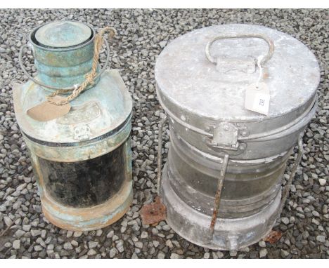 A ship's circular galvanised 'anchor' lamp and a half round 'stern' lamp.
