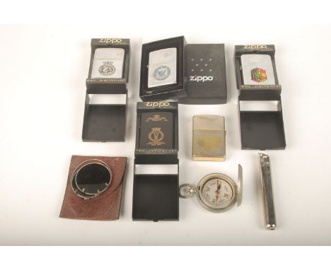 A Dennison First World War field compass dated 1916 together with various Zippo and other lighters. 