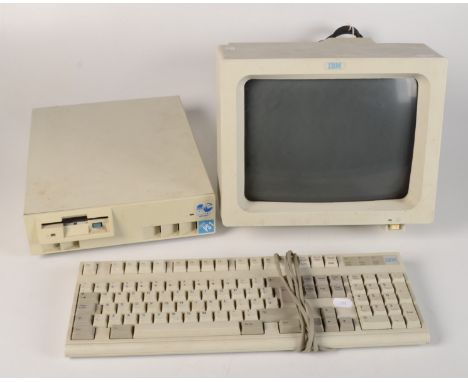 An IBM PS 1 computer, with keyboard and manual and a Canon Bubblejet printer.