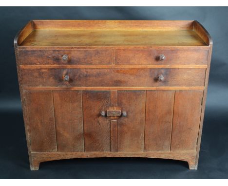 A Heals oak sideboard, circular makers plaque in the drawer inscribed 'Heal & Son, London, W', the solid gallery back above f