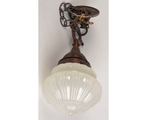 A metal and fluted opaline glass ceiling lamp, early 20th century, height 34cm.