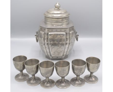 A Chinese Changsha pewter octagonal bodied tea caddy and cover with six en-suite goblet styled cups, the tea caddy with raise