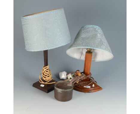 A 1930s walnut table lamp on a quarter round base mounted with a model bird, a brown Bakelite lamp and a small copper pan, he