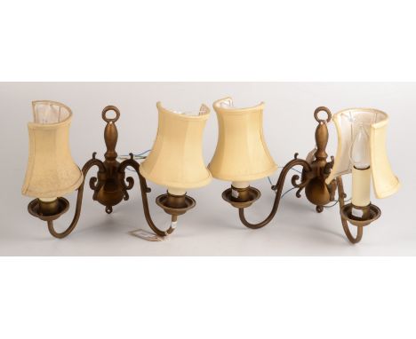 A pair of gilt metal twin branch wall light fittings with shades.