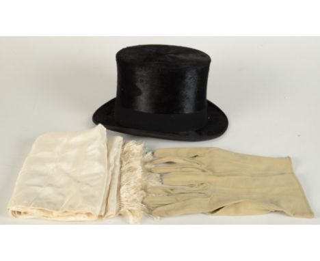 A silk top hat, inscribed 'G.A. Dunn & Co, Piccadilly Circus, 373-4-5, Strand, 54-6, Oxford St, London' and '300 / 7', a whit