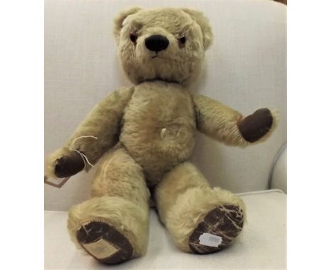 A light brown plush, Kapok stuffed teddy bear by Chad Valley, label to foot and remains of label to chest, remains of growler