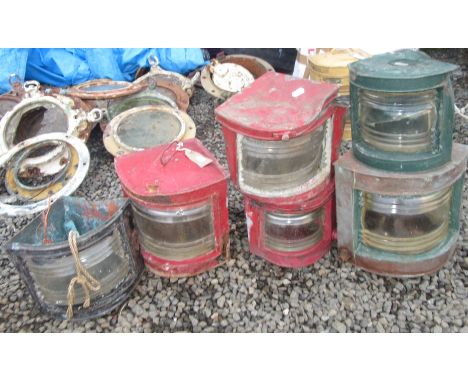 A ship's large quarter round navigation lamp, two smaller 'port' and 'starboard' lamps and four other lamps.