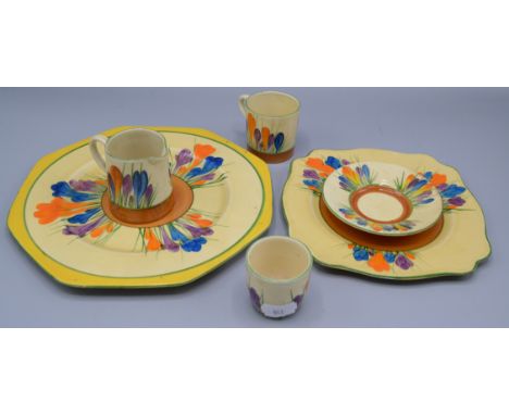 Two Clarice Cliff crocus pattern 'Bizarre' plates, 22 and 17.5cm and a jug, cup and saucer and  egg cup.    Condition report: