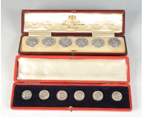 A set of six silver art nouveau buttons in case of Bracher & Sydenham's, Reading together with a set of six silver winged hea