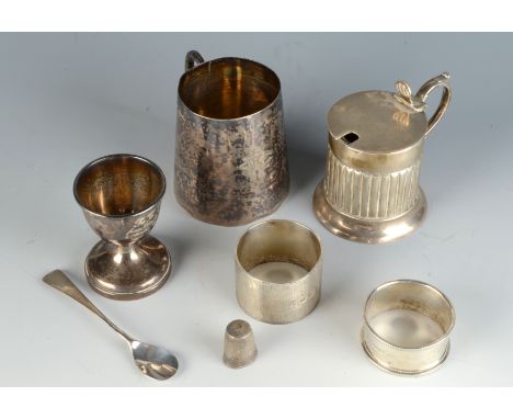 A heavy engine turned silver napkin ring, a drum mustard, a christening mug and an egg cup etc. 7.6oz.