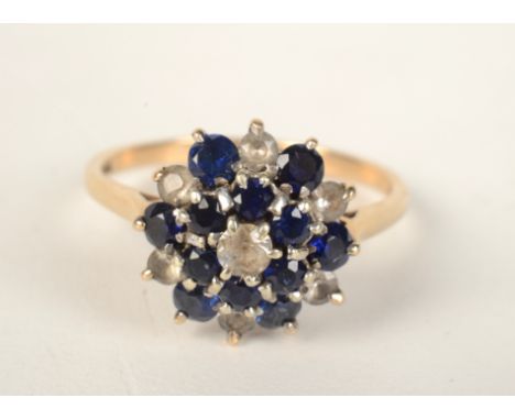 A 9ct gold blue and white stone cluster ring. 