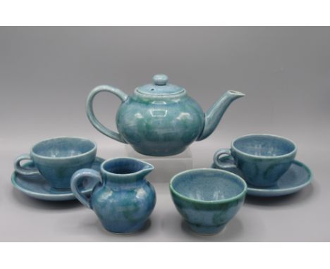 A Lamorna Studio Pottery tea service, comprising a teapot, cream jug, sugar bowl and two cups and saucers, height 10cm, diame