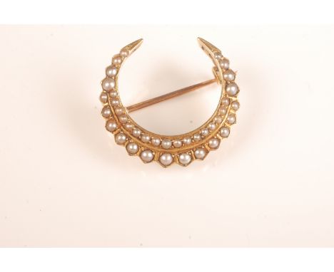A good pearl set Victorian gold crescent brooch.