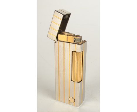 A two tone Dunhill gas Swiss Made Rollagas lighter. Black leather Dunhill belt pouch.