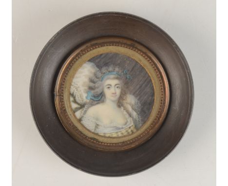 A portrait miniature of a fashionable lady apparently dated 1789, diameter 6.2cm. Condition report: The glass id dirty and wo