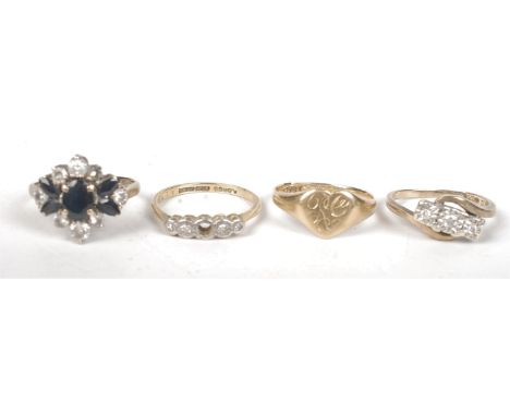 An 18ct gold signet ring, one other 18ct gold ring and two 9ct gold rings. Condition report: Weight per carat.  18ct - 5.3gms