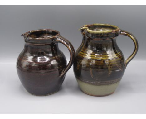 Two Winchcombe Pottery jugs, each with a brown glaze, heights 16.5cm and 15.5cm. 