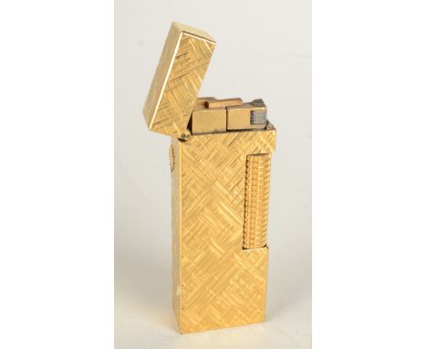 A gold plated ice textured Dunhill gas Swiss Made Rollagas lighter boxed with booklet.