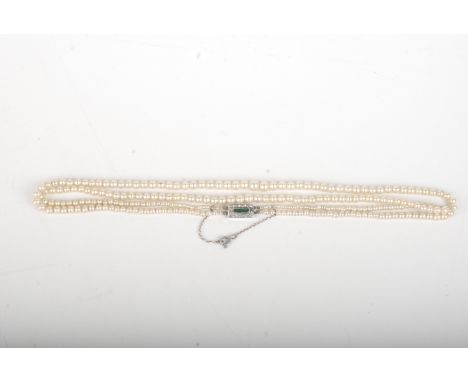 A simulated pearl necklace with paste set silver clasp.