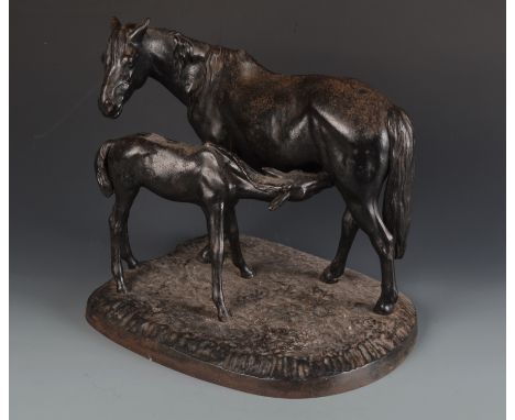 A Soviet 1972 cast iron model of mare and foal on an naturalistic base, marked to the base Kacni, height including base 30cm.