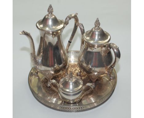 A Viners three piece tea service and a circular tray with a pierced gallery.