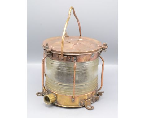A cylindrical copper and brass ships lamp, height 21cm, diameter 21cm.