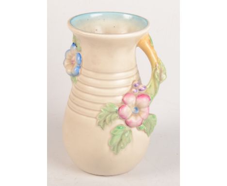 A Clarice Cliff vase, floral decorated, no 907, height 22.5cm.