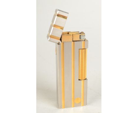 A two tone Dunhill gas Swiss made Rollagas lighter serial 19189 boxed.