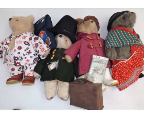 Three Paddington Bear soft plush toys and a similar Aunt Lucy, the four lack some clothing etc.   Condition report:  The bear