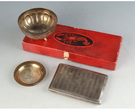 An engine turned silver notebook the interior blue leather lined together with three other pieces.