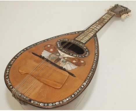 An Italian mandolin, with tortoishell and mother of pearl decorated butterfly with paper label inscribed 'Mandolino IL GLOBO 