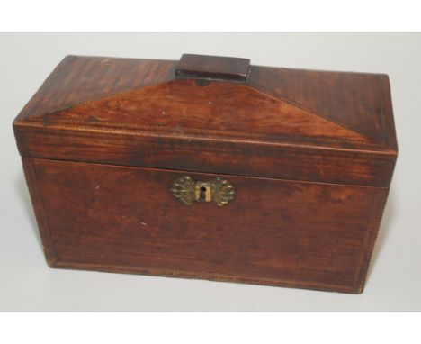 A Georgian mahogany and inlaid sarcophagus shaped tea caddy, the interior with two lidded sections flanking a cut glass bowl,