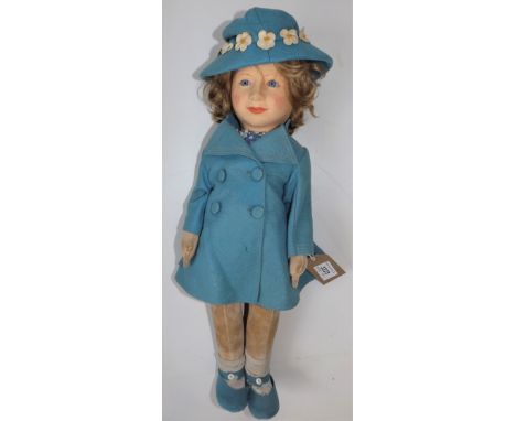 A child doll by Chad Valley, the felt moulded head on a felt part articulated body, Chad Valley label to foot, full length 18